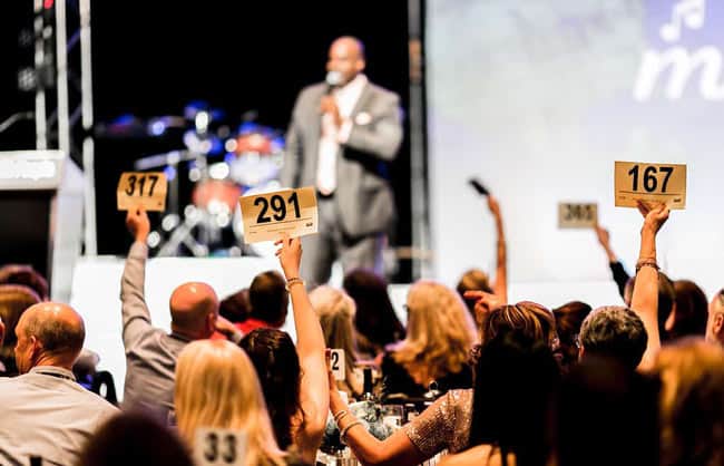 up with people paddle raise auction